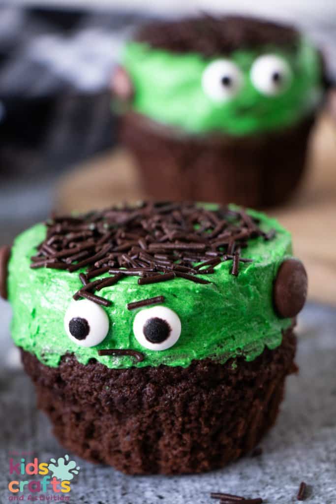 Halloween cupcake with green frosting and black sprinkles