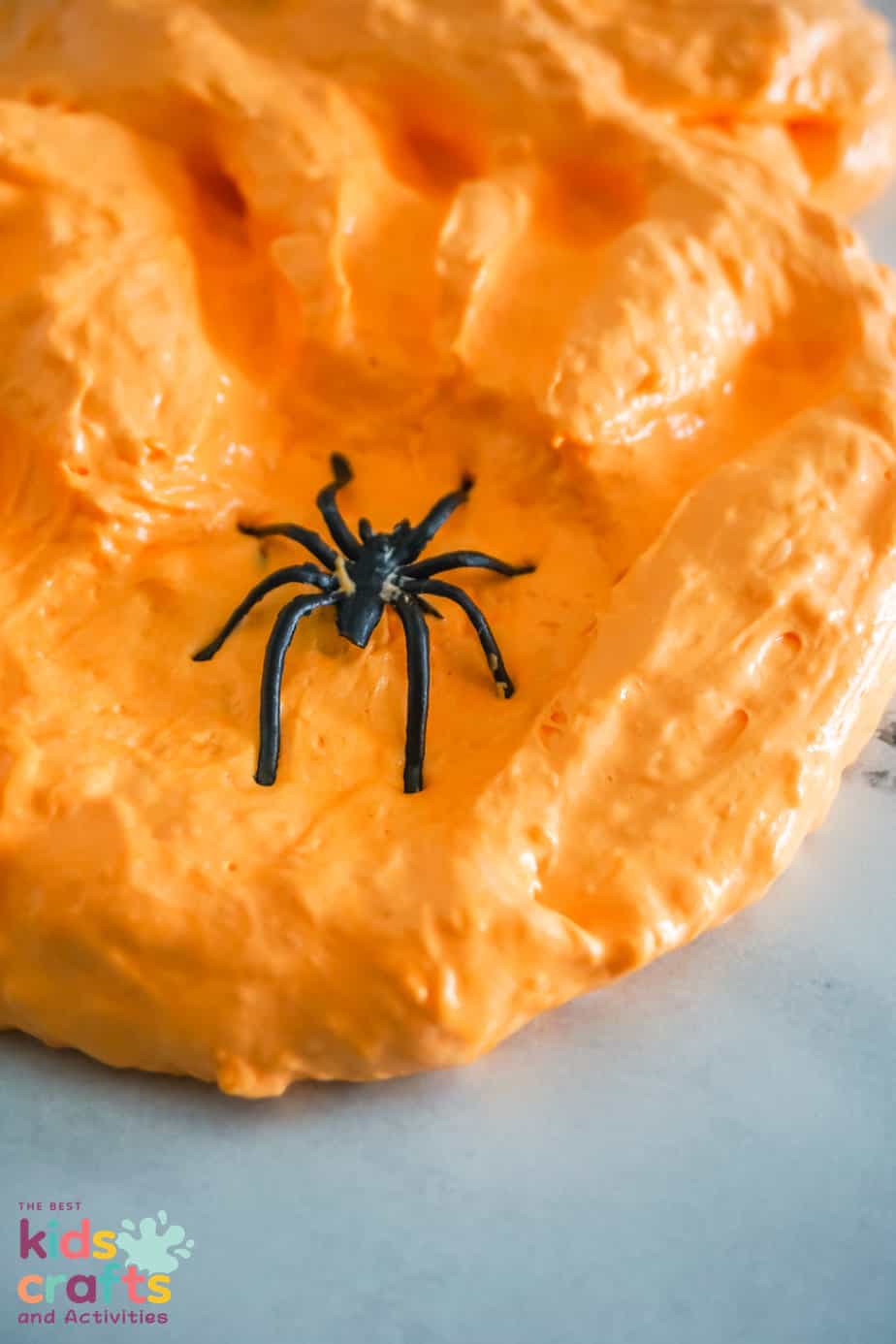 close up photo of Orange Halloween Fluffy Slime Recipe