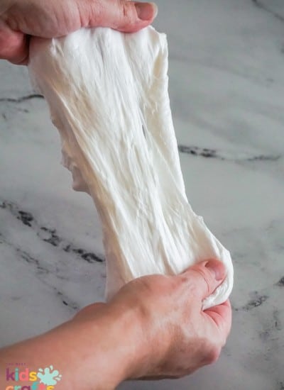 Fluffy Slime Recipe being stretched out in kids hands