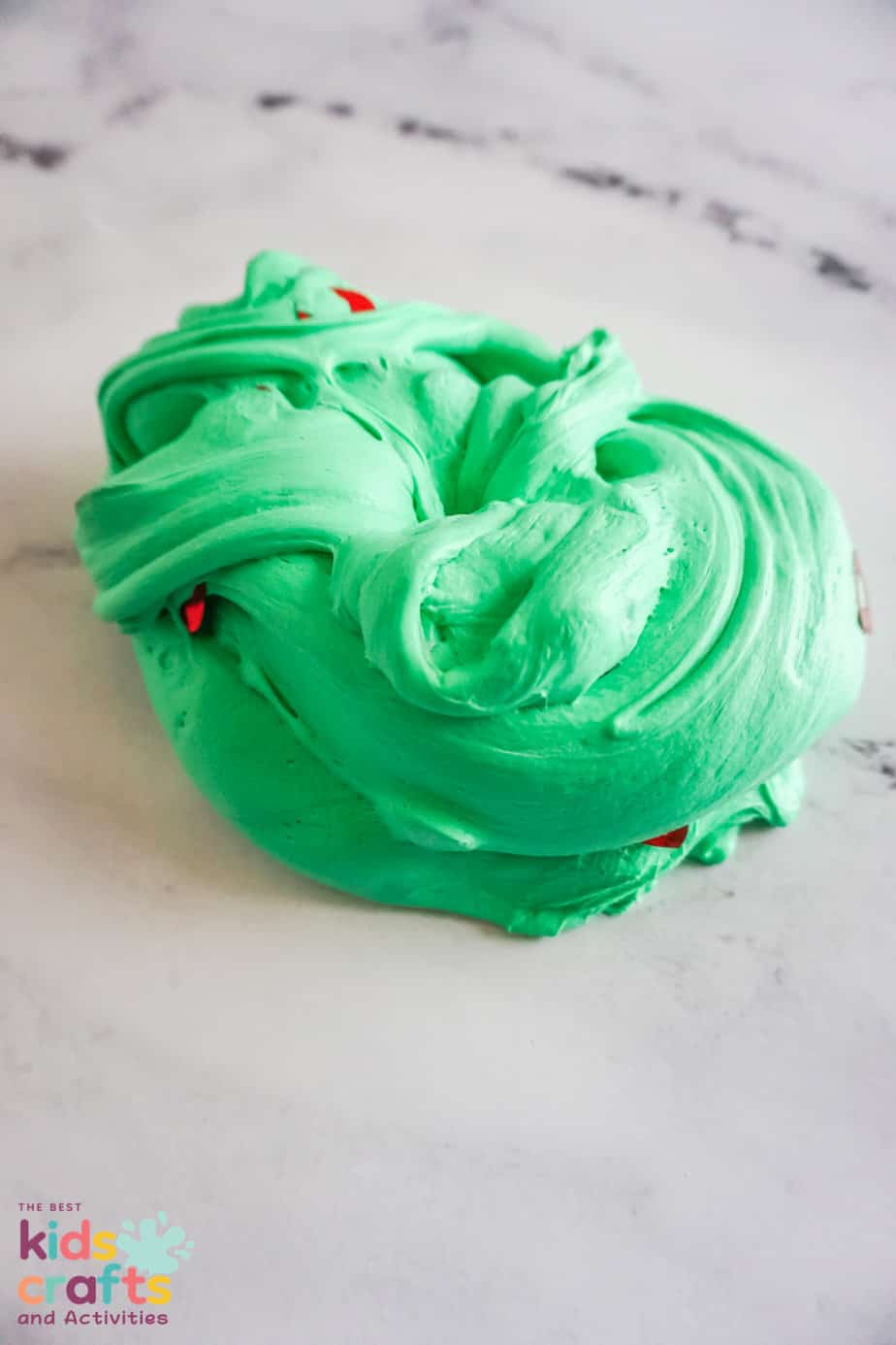green grinch butter slime smushed into a ball