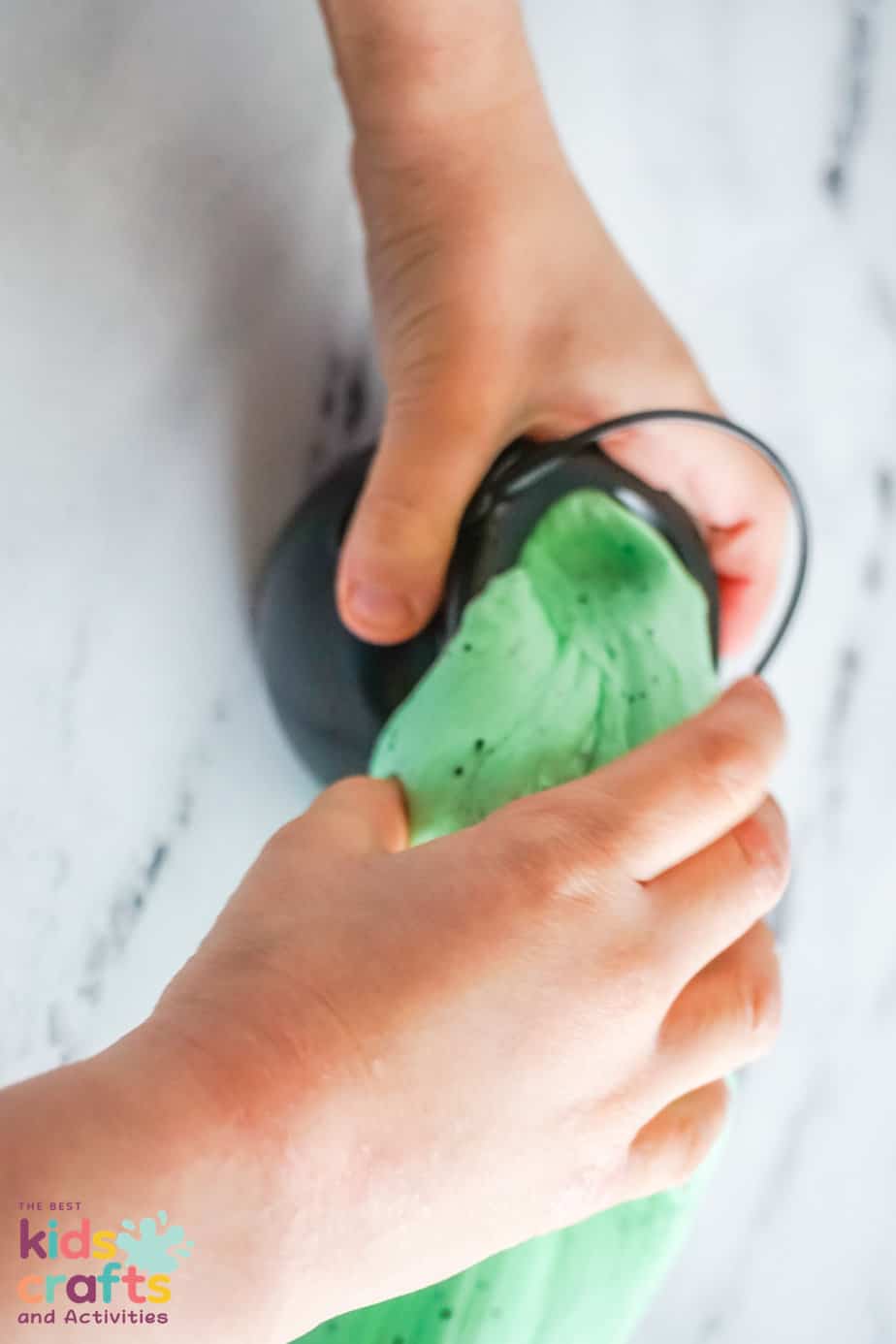 kids playing with Halloween green butter slime 