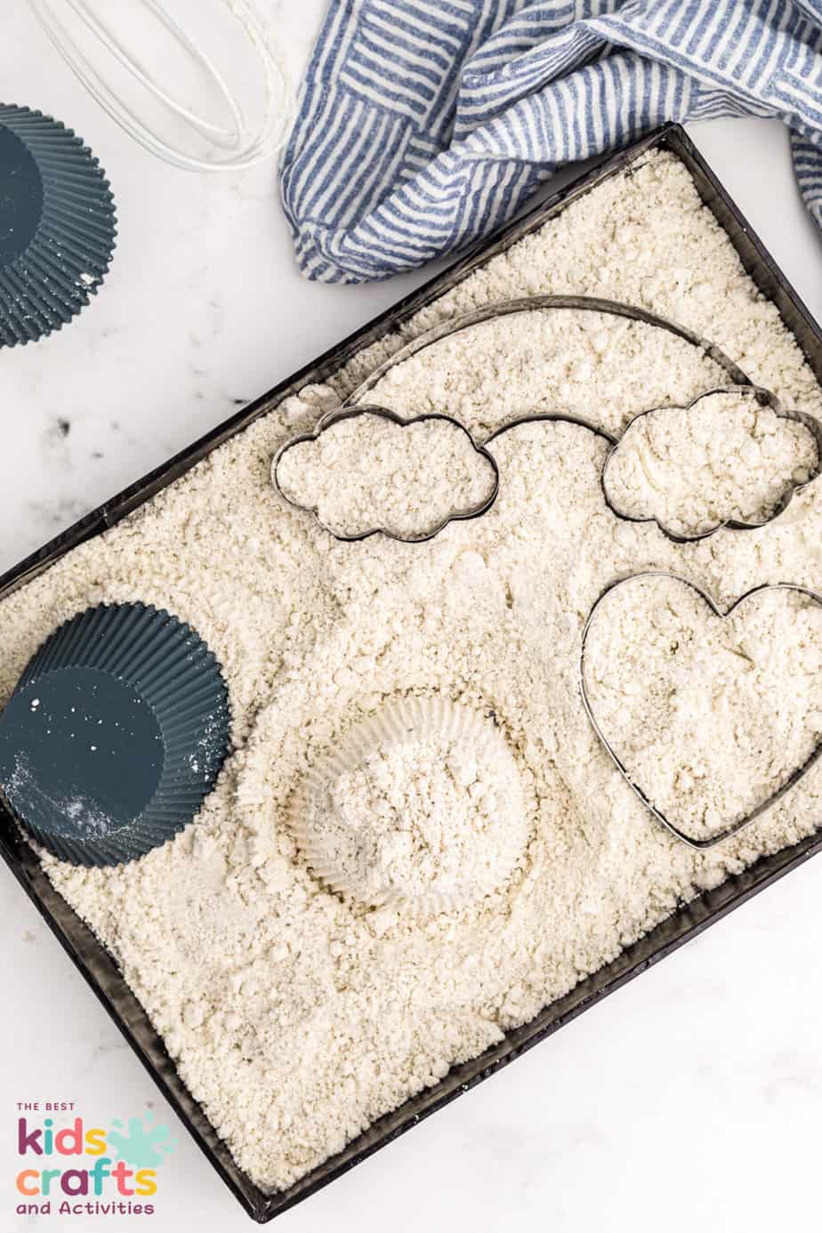 overhead photo of a baking sheet of Homemade moon sand